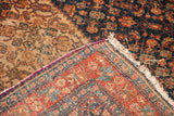 Antique Senneh rug corner revealing tight weave, purple silk selvage, and herati motif.