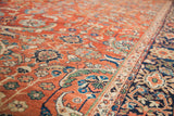 Saturated green and blue floral patterns on the rust field of a late 19th-century Persian Fereghan carpet.