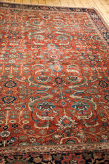 Detail of antique Fereghan carpet: allover floral design in rich rust, blue, green, gold.