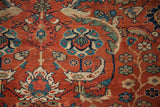 Saturated greens, blues, and gold in the antique Persian Fereghan rug's botanical design.