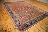 Antique Fereghan carpet corner, detailing rust field, blue border, intricate floral, vine motifs, fresh fringe.