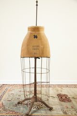 Vintage skirt dress form wire frame and ornate time-softened metal claw-foot base.