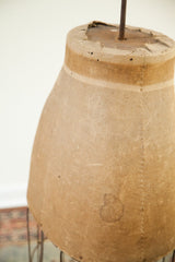 Deep patina and a visible dark stain on the rare skirt dress form fabric.