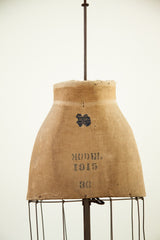 Vintage skirt dress form, 'MODEL 1915 36' stenciled on aged canvas fabric with label.