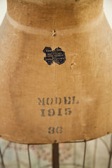 Vintage skirt dress form detail, showing deep patina, partially intact Kramer label, 