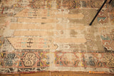 Worn, blanched pile with muted geometric patterns on an antique Turkish prayer rug.