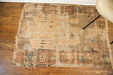 Blanched aesthetic with faded geometric patterns on a tattered antique Turkish prayer rug.