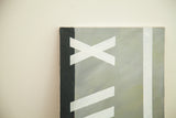 Corner detail of a modern painting showing the canvas texture and abstract shapes in black, white, and grey.