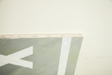 Detail showing the stapled edge and texture of the acrylic painting's canvas.