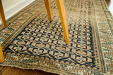 Tight weave and characteristic geometric design of the worn antique Caucasian rug.