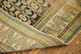 Tightly woven edge showing hard wear on a geometric antique Caucasian rug.