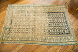 Geometric border with notable wear at the corner of the antique Caucasian rug.