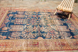 Detail of antique Kerman rug's dark blue field, weeping willow motifs, allover pattern, distressed patina.