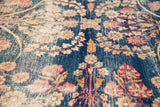 Fine Kerman weave showing weeping willow motif and aged texture on dark blue.