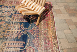 Ornate deep red border of antique Persian Kerman carpet with faded blue weeping willow field.