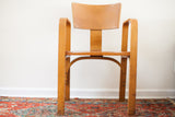 Curved bent plywood backrest and contoured seat of the vintage Thonet chair.