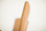 Small chip and rich patina on the bent plywood edge of the Thonet chair.