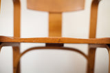 Chip, surface markings, and aged patina on the early Thonet bent plywood chair.