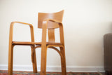Early Vintage Thonet bent plywood chair featuring fluid lines and a warm wood patina.