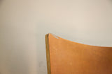 Small chip visible on the upper section of the vintage Thonet chair's bent plywood back.