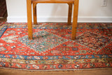Antique Persian Heriz fragment rug, bold geometric medallion, vivid red, blue, green, plum. 3'6