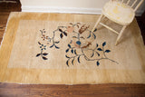 Thick pile antique Chinese Nichols rug featuring cream, canary yellow, and curvilinear Art Deco florals.