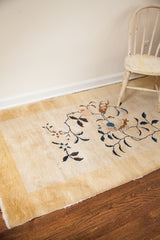 Thick pile and intricate floral design details on this antique Art Deco Chinese rug.