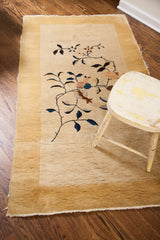 Antique Chinese Nichols rug, cream field, canary yellow border, and stylized Art Deco florals.