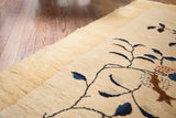 Thick pile Art Deco Chinese rug corner, showing cream, yellow, blue, and brown stylized motifs.