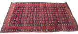 Afghani geometric rug runner with dark charcoal field and natural cranberry red patterns, 3'4