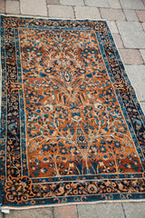 Antique 1915 Persian Yezd rug's deep gold field and intricate Tree-of-Life with birds.