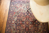 Antique Persian Kerman rug, ornate floral medallion, rich navy, red, and cream colors, 4x6.