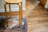 Vintage mid-century Alvar Aalto style tall light wood stool, round top, curved legs.
