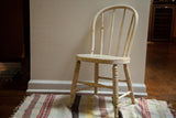 Shabby chic antique child's Windsor chair, chippy ivory white with yellow accents.