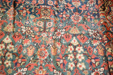 Intricate texture of antique Persian Fereghan carpet, showing rare green field and pomegranate motifs.