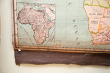 Detail of antique Africa map's lower left, with Atlantic Ocean, land relief, and visible tears and holes on the bottom.