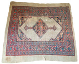 Distressed antique Persian Serab square rug, camel field with geometric coral, navy patterns.