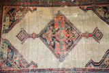Distressed antique Persian Serab rug, worn camel field, geometric medallion.