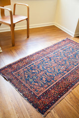 Vintage 1920s Malayer runner's allover herati design in rich indigo with coral borders.