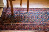 Intricate herati design and fine weave on a vintage Malayer runner in indigo and coral.