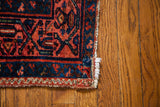 Hand-knotted edge of Malayer runner, showing vibrant indigo and red herati pattern.