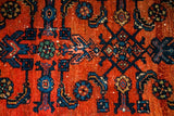 Vintage Persian Engelas rug detail: deep madder root red field, clear blue and green herati motifs.