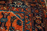 Detailed blue Herati pattern on deep madder red hand-knotted Engelas rug.