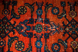 Deep madder red Persian Engelas detail: loosely drawn blue and green Herati motifs.
