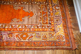 Right corner of the vintage Turkish prayer rug with orange plainweave, mauve, and silver patterns.