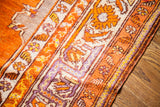 Turkish Prayer rug's vibrant orange field and unique mauve, silver patterned border.