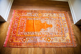 Vintage 1930s Turkish prayer rug corner with reddish fringe and orange, mauve, silver border.