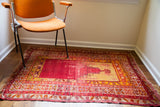 Vintage 1915 antique Turkish prayer rug with distressed red field, yellow niche, and colorful borders, 3'5
