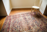 Antique Persian Kerman rug, decorative distressed, featuring sapphire blue and ruby red floral motifs.