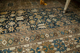 Antique Caucasian rug with geometric borders and unusual abrashed teal field.